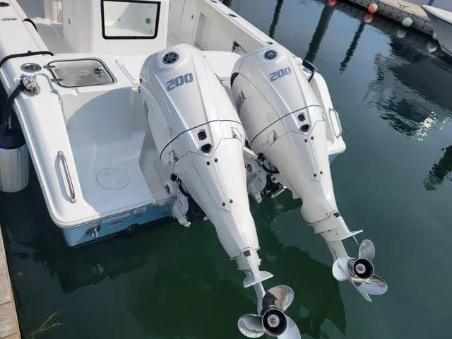 Slide: The Image of 2024 Sea Hunt Gamefish 27 boat with twin 200 horsepower outboard engines. - 6