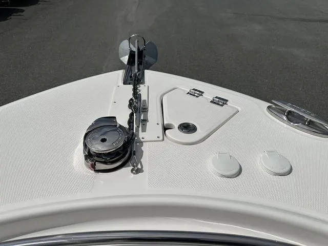Slide: The Image of Bow of 2022 Robalo R242 boat with anchor and deck fittings. - 18