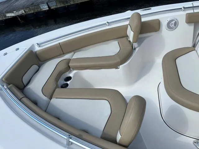 Slide: The Image of 2020 Key West 219fs boat interior with beige seating and cup holders. - 4