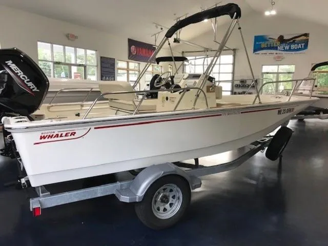 Slide: The Image of 2023 Boston Whaler 170 Montauk boat on trailer in showroom. - 4