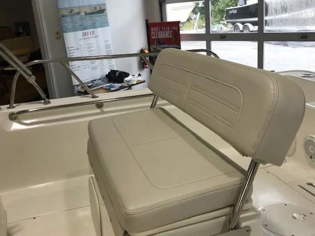 Slide: The Image of 2023 Boston Whaler 170 Montauk boat interior with cushioned seating. - 9