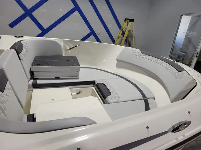 Slide: The Image of 2023 Bayliner Element M17 boat interior with cushioned seating and modern design. - 13