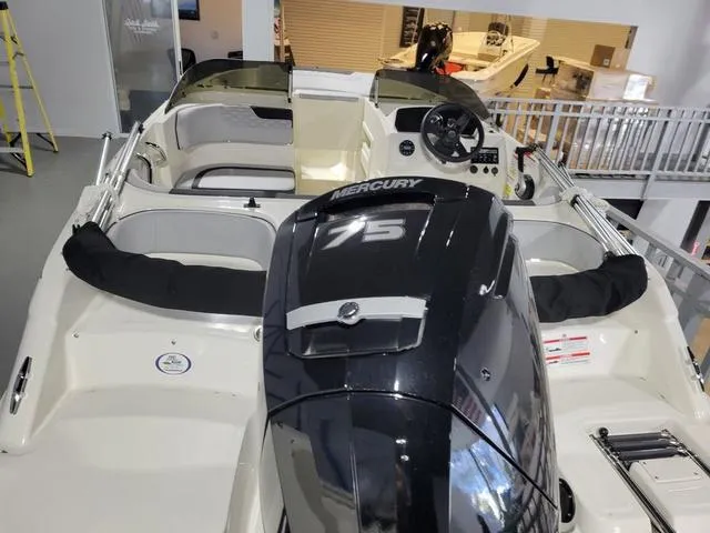 Slide: The Image of 2023 Bayliner Element M17 boat with Mercury 75 engine, interior view. - 9