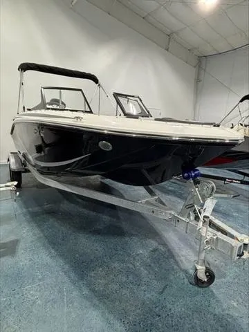 Slide: The Image of 2024 Bayliner M17 boat on trailer in indoor showroom. - 3