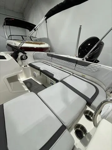 Slide: The Image of 2024 Bayliner M17 boat interior with cushioned seating and modern design. - 8