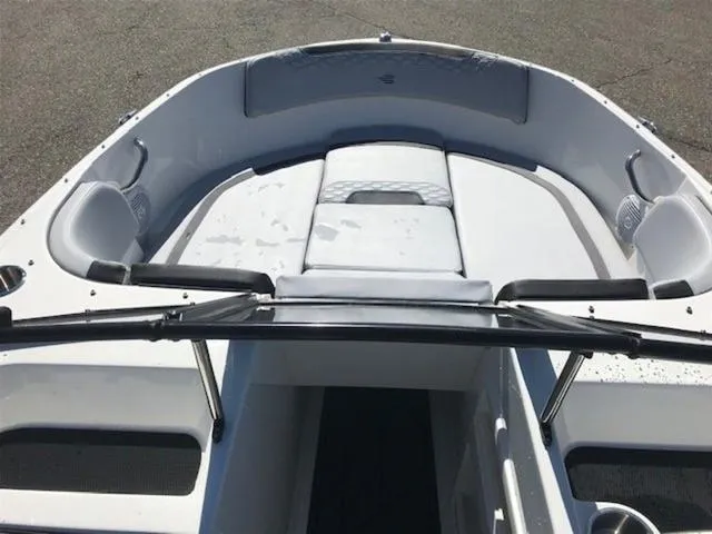 Slide: The Image of 2024 Bayliner M17 boat interior with cushioned seating and sleek design. - 11