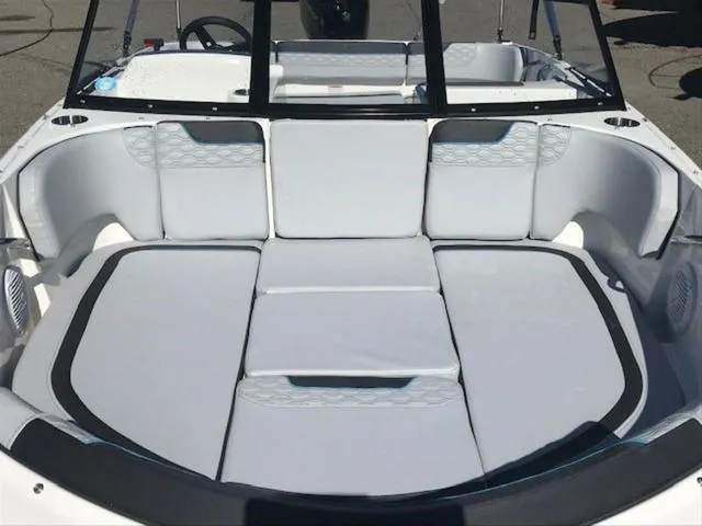 Slide: The Image of 2024 Bayliner M17 boat interior with spacious white seating area. - 7