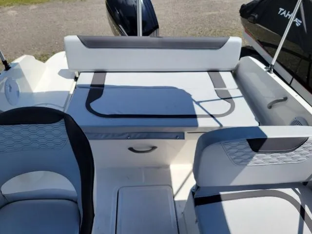 Slide: The Image of 2024 Bayliner M19 boat interior with seating and storage compartments. - 10
