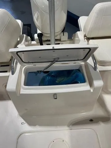 Slide: The Image of 2024 Grady-White Freedom 215 boat with open storage compartment. - 10