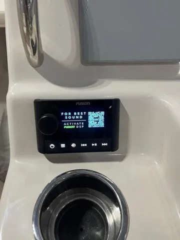 Slide: The Image of Fusion audio system on 2024 Grady-White Freedom 215 boat dashboard. - 16
