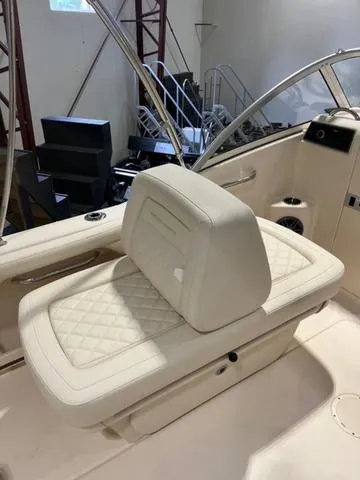 Slide: The Image of 2024 Grady-White Freedom 215 boat interior with cushioned seating. - 9
