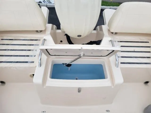 Slide: The Image of 2025 Grady-White Freedom 215 boat interior with open storage compartment. - 10
