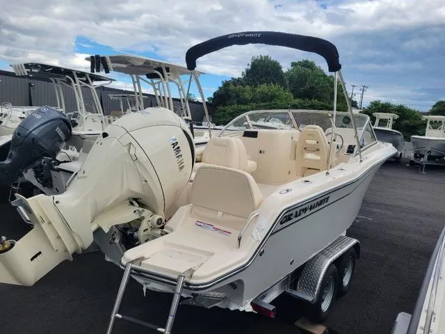 Slide: The Image of 2025 Grady-White Freedom 215 boat on trailer, featuring Yamaha outboard motor. - 4