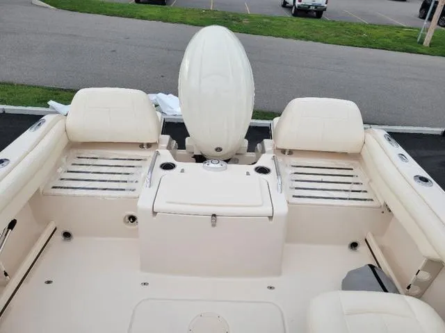 Slide: The Image of 2025 Grady-White Freedom 215 boat interior with seating and engine view. - 9