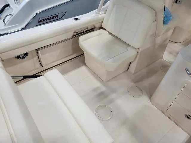 Slide: The Image of 2024 Grady-White Freedom 255 boat interior with white seating and clean design. - 10