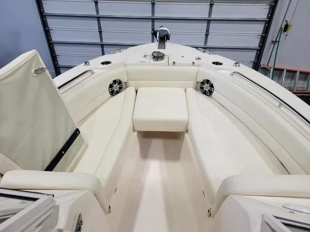 Slide: The Image of 2024 Grady-White Freedom 255 boat interior with white seating and modern design. - 15