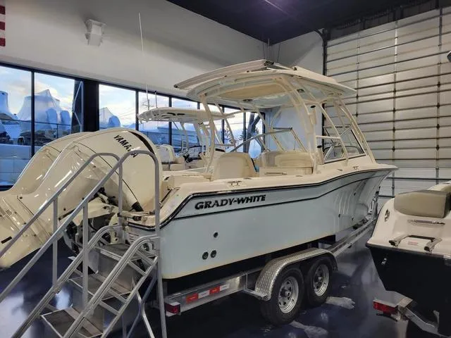 Slide: The Image of 2024 Grady-White Freedom 255 boat on trailer in showroom. - 3