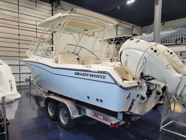 Slide: The Image of 2024 Grady-White Freedom 255 boat on trailer in showroom. - 4