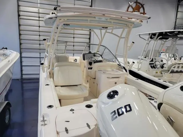 Slide: The Image of 2024 Grady-White Freedom 255 boat with 200 horsepower engine in showroom. - 5