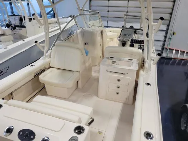 Slide: The Image of 2024 Grady-White Freedom 255 boat interior with seating and helm station. - 6