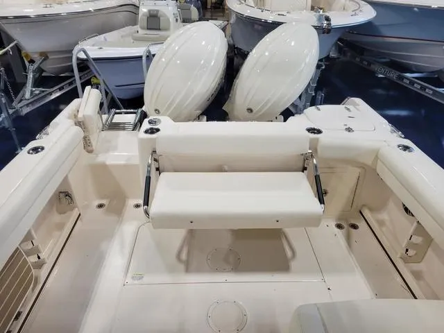 Slide: The Image of 2024 Grady-White Freedom 255 boat interior with dual outboard motors. - 9