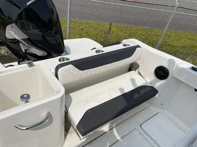 Slide: The Image of 2023 Trophy T 24 CC boat interior with seating and storage compartments. - 11