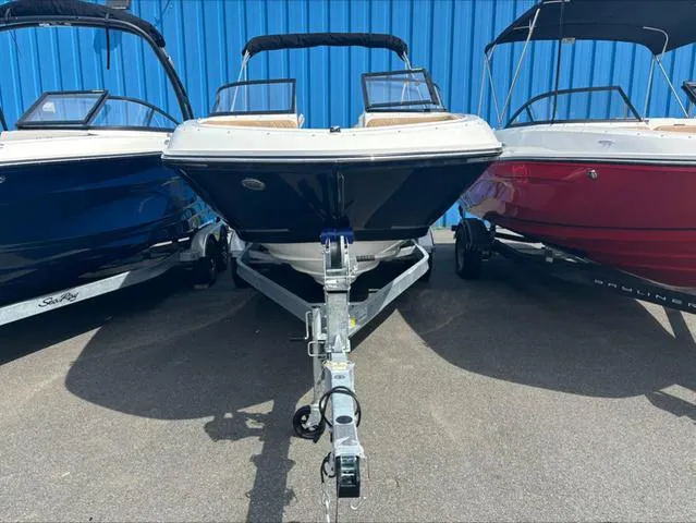 Slide: The Image of 2024 Bayliner VR6 boat on trailer, flanked by two other boats, against blue background. - 3