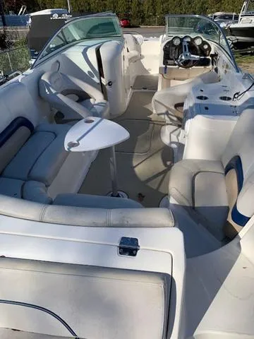 Slide: The Image of 2006 Hurricane 25' DC boat interior with seating and steering console. - 20