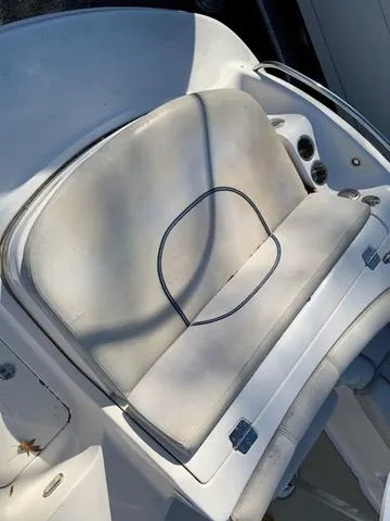 Slide: The Image of 2006 Hurricane 25' DC boat seat with visible wear and shadow. - 21