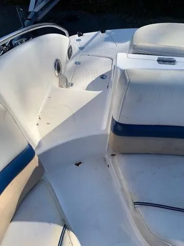 Slide: The Image of 2006 Hurricane 25' DC boat interior with white and blue seating. - 28