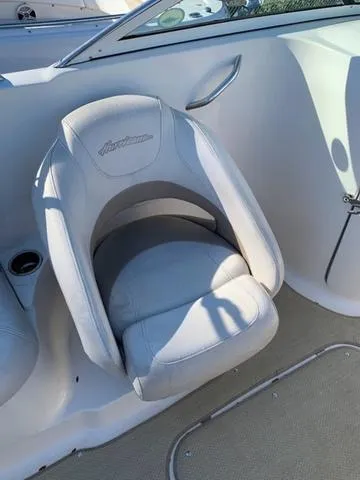 Slide: The Image of 2006 Hurricane 25' DC boat seat, white upholstery, interior view. - 29