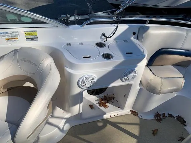 Slide: The Image of 2006 Hurricane 25' DC boat interior with seating and cup holders. - 31