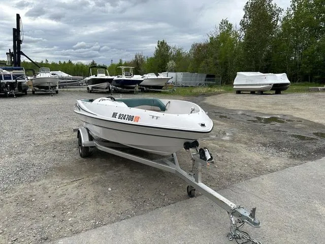 Slide: The Image of 1995 Four Winns Fling boat on trailer in outdoor storage area. - 6