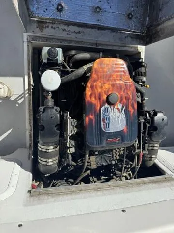 Slide: The Image of Engine compartment of a 1996 Eastern 27 Lobster Fisherman boat with custom flame design. - 3