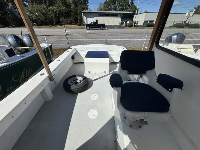 Slide: The Image of 1996 Eastern 27 Lobster Fisherman boat interior with seating and storage. - 7