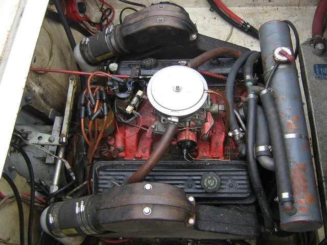 Slide: The Image of Engine compartment of 1983 Bayliner 2850 Contessa boat, showing detailed mechanical components. - 14