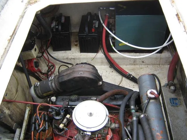 Slide: The Image of Engine compartment of a 1983 Bayliner 2850 Contessa with visible batteries and wiring. - 15