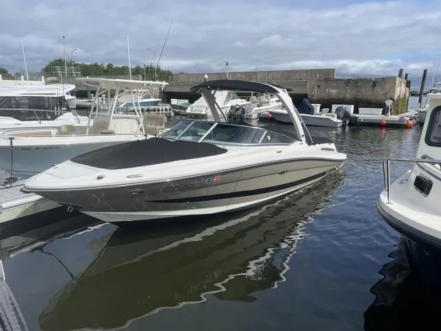 Slide: The Image of 2010 Sea Ray 25 SELECT EX boat docked in marina, overcast sky. - 2