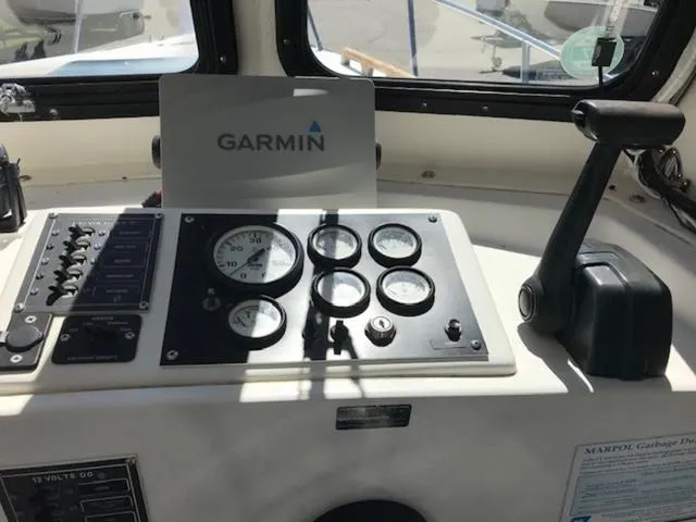 Slide: The Image of Control panel of a 2003 Eastern 27' Lobster boat with Garmin navigation system. - 17