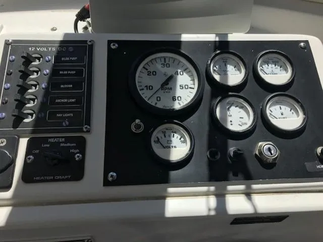 Slide: The Image of Dashboard of a 2003 Eastern 27' Lobster boat with gauges and controls. - 8