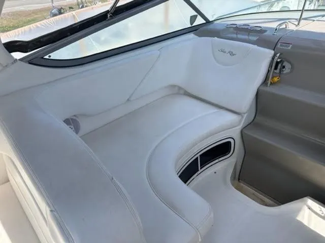 Slide: The Image of 2007 Sea Ray 280 Sundancer interior seating with white upholstery and sleek design. - 7