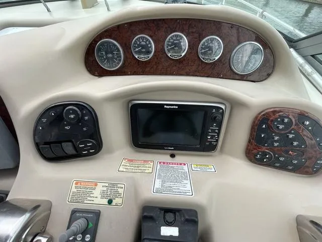 Slide: The Image of Dashboard of 2003 Sea Ray 340 Sundancer with gauges and navigation system. - 17