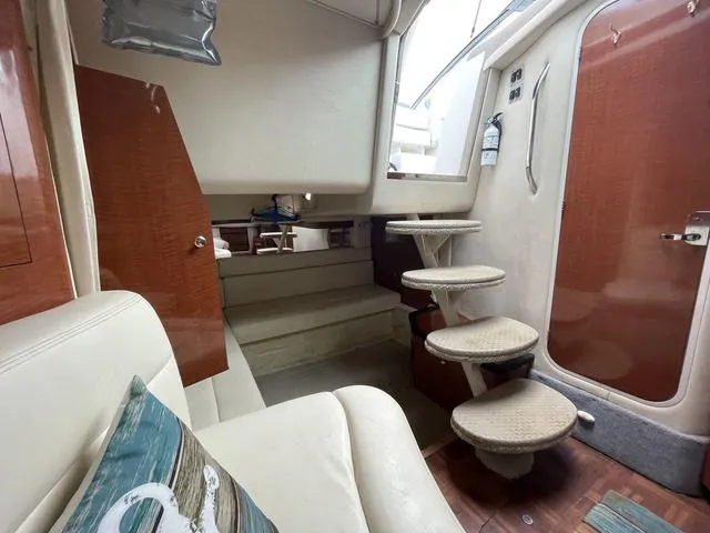 Slide: The Image of Interior of 2003 Sea Ray 340 Sundancer yacht with stairs and seating area. - 7