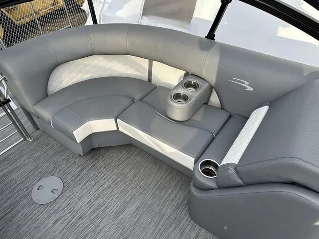 Slide: The Image of 2021 Bennington 22 LFB boat interior with gray seating and cup holders. - 10