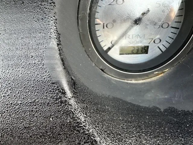 Slide: The Image of Close-up of a Bennington 22 LFB 2021 boat RPM gauge with condensation. - 12