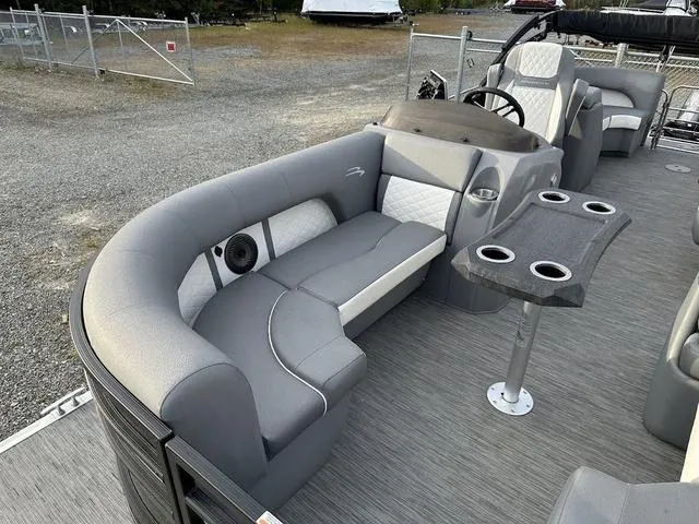 Slide: The Image of 2021 Bennington 22 LFB pontoon boat interior with gray seating and table. - 6