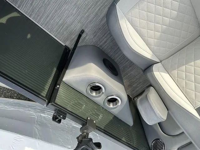 Slide: The Image of 2021 Bennington 22 LFB interior with gray seating and cup holders. - 8