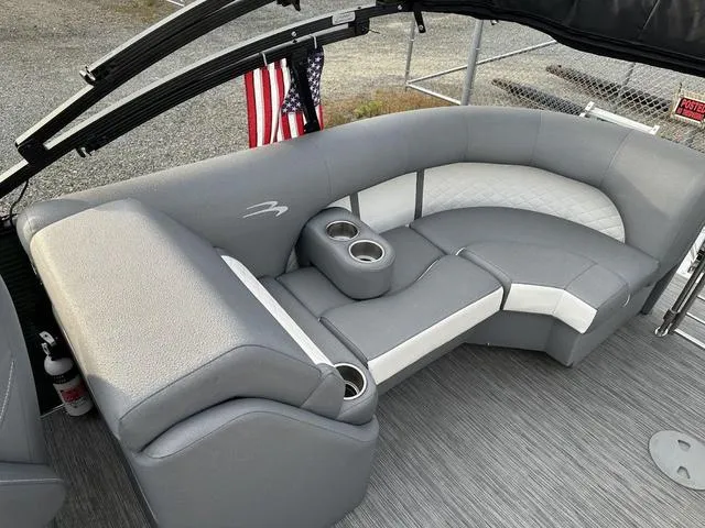 Slide: The Image of 2021 Bennington 22 LFB boat interior with gray seating and cup holders. - 9