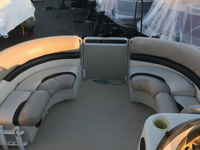 Slide: The Image of 2013 Cypress Cay Seabreeze 180 pontoon boat interior with curved seating. - 12