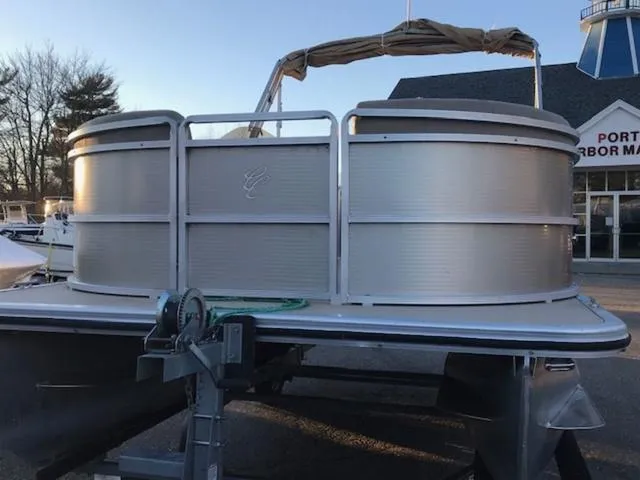 Slide: The Image of 2013 Cypress Cay Seabreeze 180 pontoon boat on trailer at marina. - 4